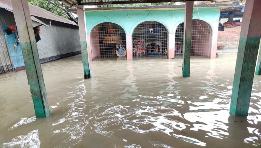 Residents of Tangail district's Bhuyapur upazila navigate floodwaters that have submerged homes, markets, and agricultural lands, leaving 36,000 people trapped in the remote char areas. Humanitarian aid is being distributed to those affected.