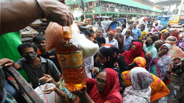 "Long queues of buyers waiting at a TCB truck sale in the Mugda area of Dhaka, hoping to secure essential commodities at subsidized prices." Photo: A H Mintu/V7N