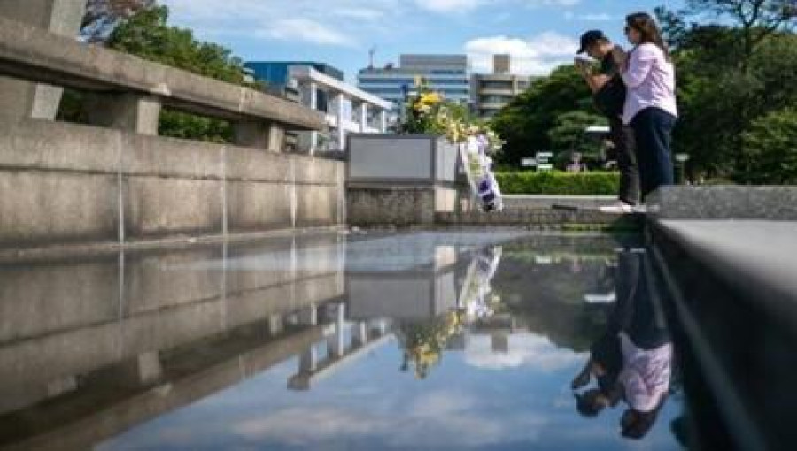 United States dropped atomic bombs on Hiroshima and Nagasaki, killing approximately 140,000 people in Hiroshima and 74,000 in Nagasaki, including those who succumbed to radiation exposure in the following months and years