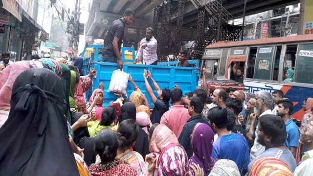 TCB trucks loaded with essential commodities prepare to serve low-income households across Bangladesh.