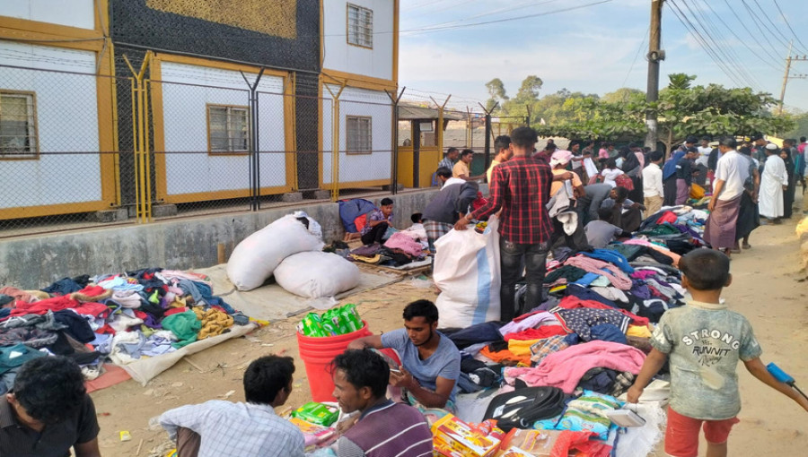 Rohingya refugees and locals shopping for winter clothes at makeshift stalls in the Ukhiya-Teknaf camps, as aid from NGOs remains scarce.