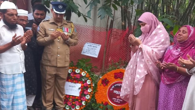 Officials offer prayer at the graves of quota reform martyrs in Madaripur, pledging justice and support to their families.