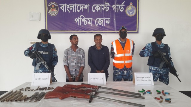 Bangladesh Coast Guard members seize firearms and arrest two suspected pirate gang affiliates during an anti-bandit operation in the Sundarbans’ Sharbatkhali area on August 6.