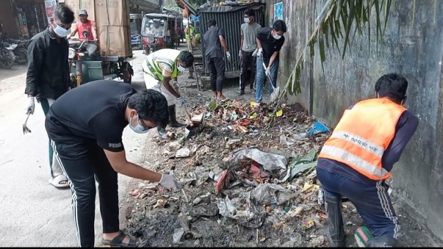 "Volunteers in Mongla clean roads and surrounding areas to prevent dengue and chikungunya."