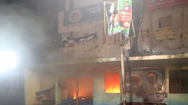 Police fire water cannons and sound grenades as protesters set fire and vandalize the Jatiya Party central office in Dhaka’s Paltan area on Friday evening.