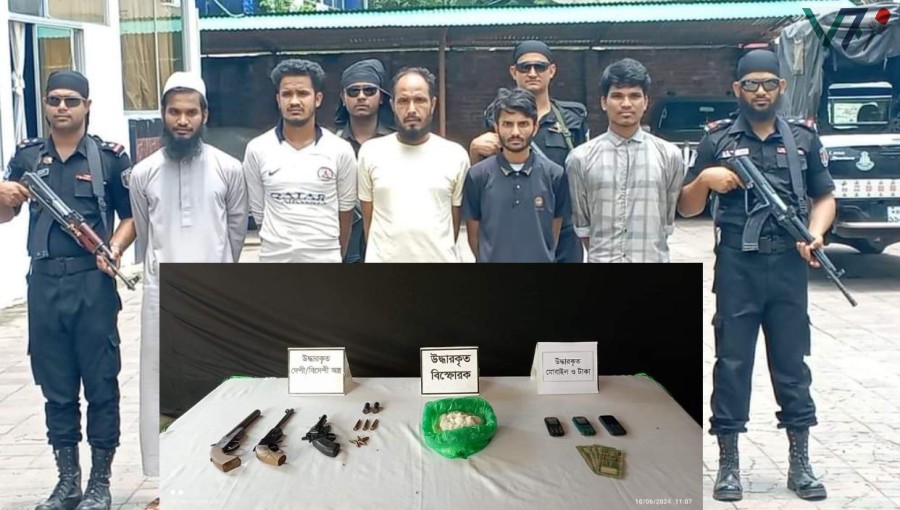 "Rapid Action Battalion (RAB) officers display confiscated weapons and ammunition after the arrest of top 5 ARSA commanders in Ukhiya. Photo: Voice7 News