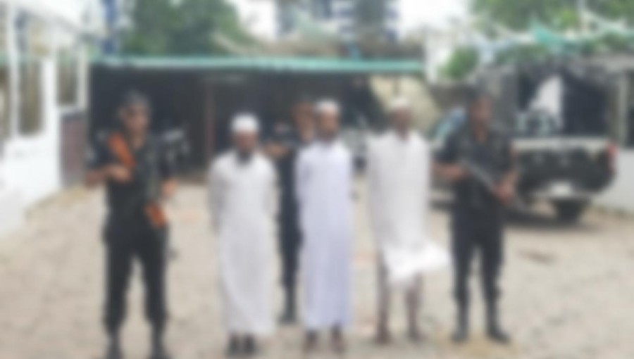 RAB officials display extremist books and materials recovered during the arrest of three members of the banned militant organization 'Ansar Al Islam,' now operating under the name As-Shahadat, in Cox's Bazar.