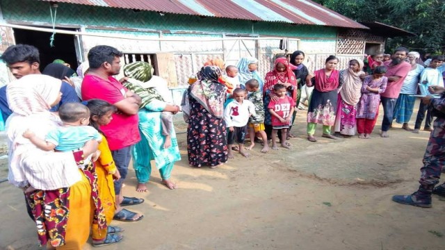 “Border Guard Bangladesh (BGB) personnel escort a group of detained individuals accused of illegally crossing into Bangladesh from India, near the Khagrachari frontier.”