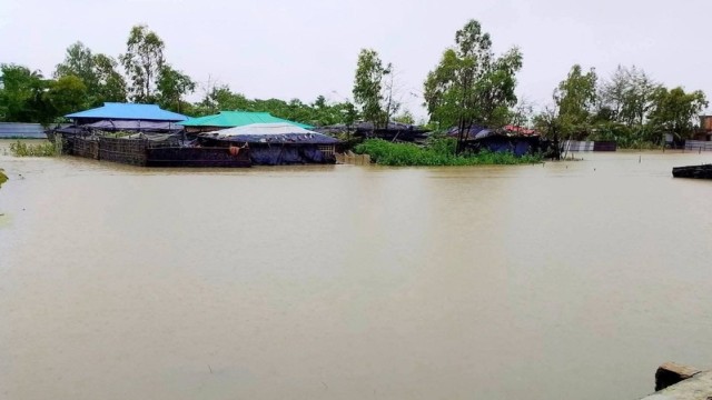 Heavy rainfall over several days has submerged villages in Teknaf, forcing thousands to flee their homes amid fears of landslides. (Photo: V7N)