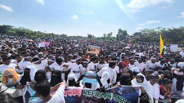 Rohingya refugees hold banners and chant slogans during a rally at Leda Camp in Teknaf on August 25, marking the eighth anniversary of the 2017 crackdown in Myanmar. They called for justice and a safe return to their homeland in Rakhine.
