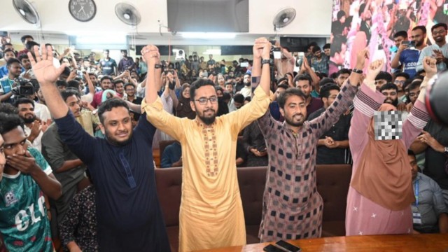Newly elected JUCSU VP Abdur Rashid Jitu and GS Mazharul Islam celebrate their victory with supporters on the Jahangirnagar University campus.