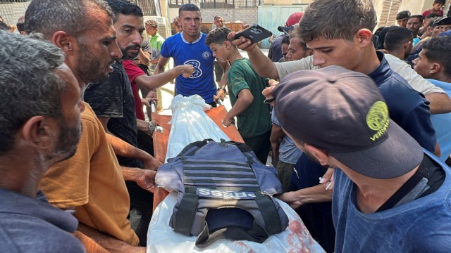 Mourners carry the body of Hussam al-Masri, a Reuters cameraman killed in an Israeli strike on Nasser Hospital in Khan Younis, Gaza, August 25, 2025.